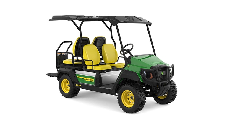 A green Gator with four yellow seats facing front-right on a white background.