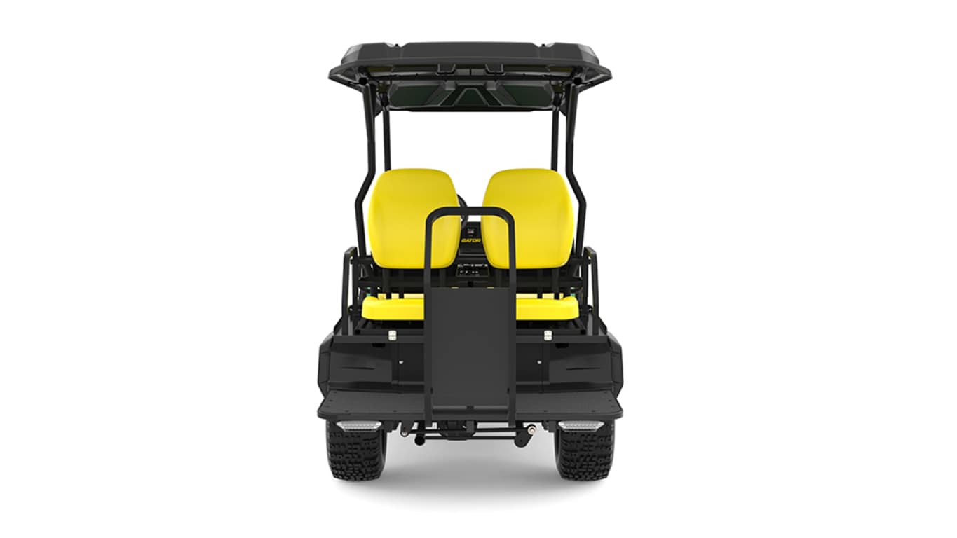 A green Gator with four yellow seats facing backward on a white background.