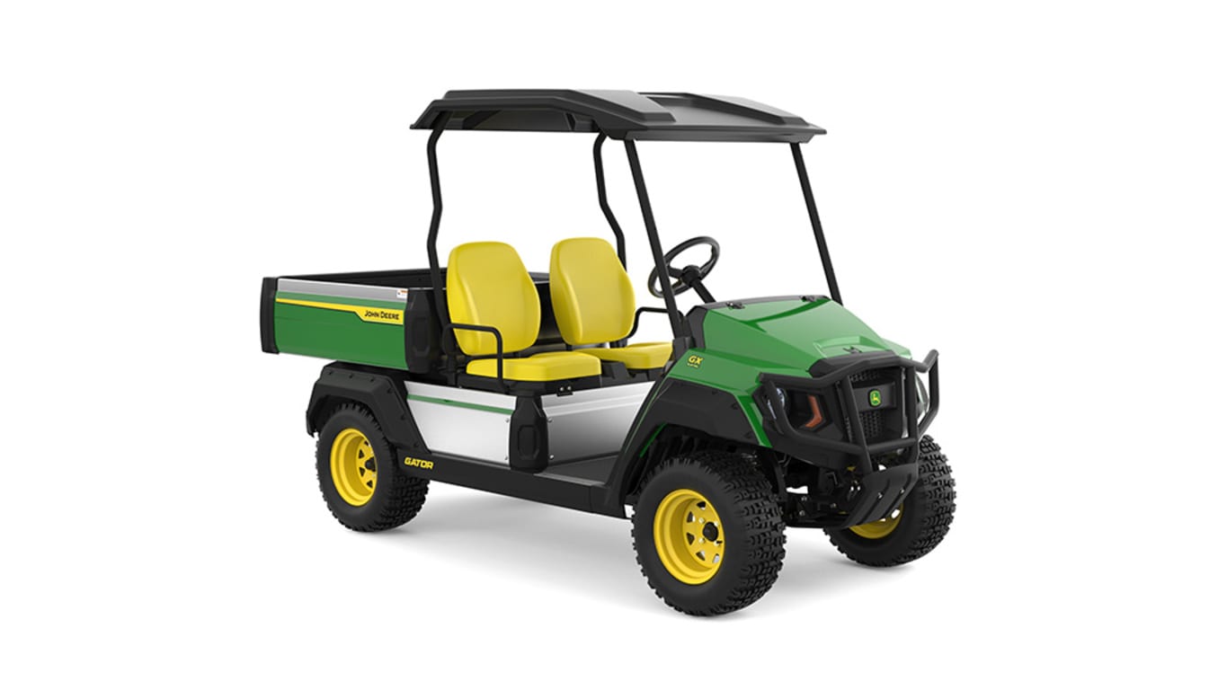 A green Gator with two yellow seats and large cargo box facing front-right on a white background.