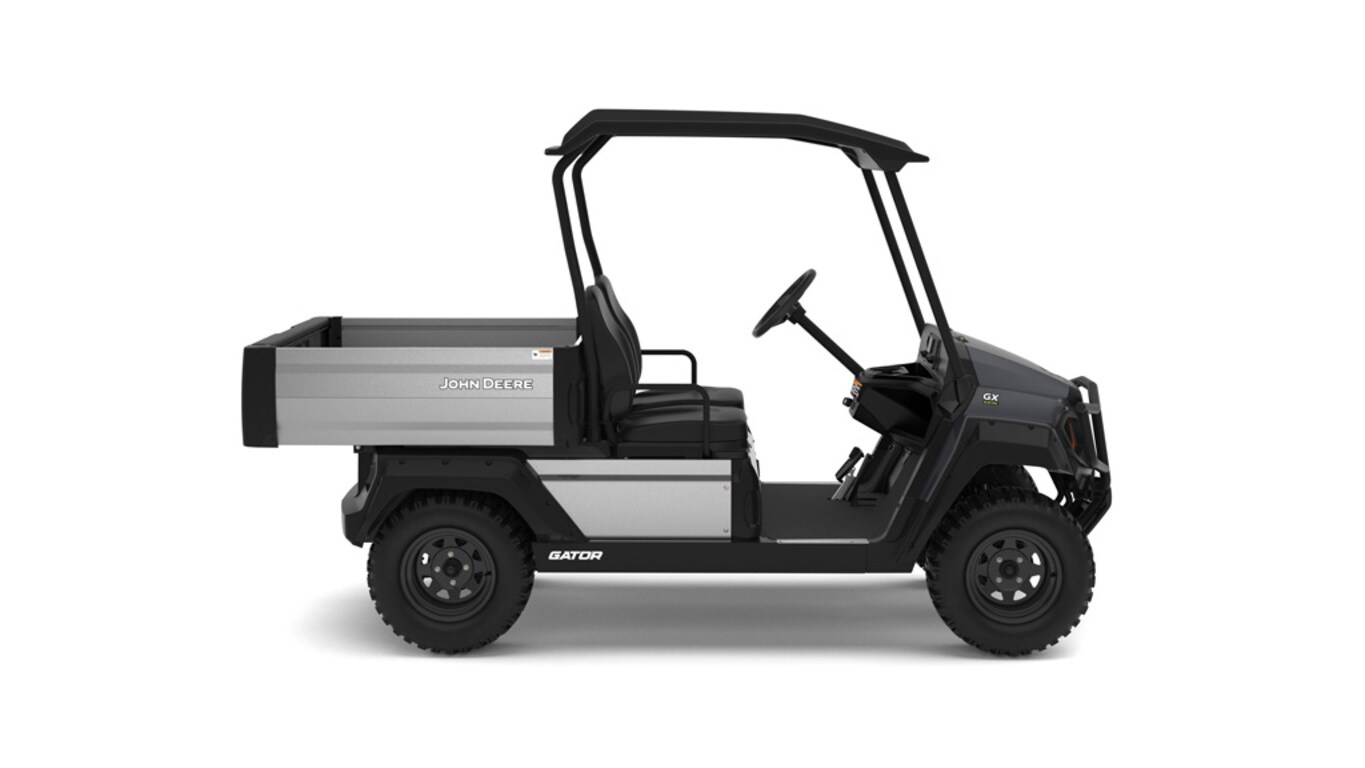 A gray Gator with two seats and large cargo box facing right on a white background.