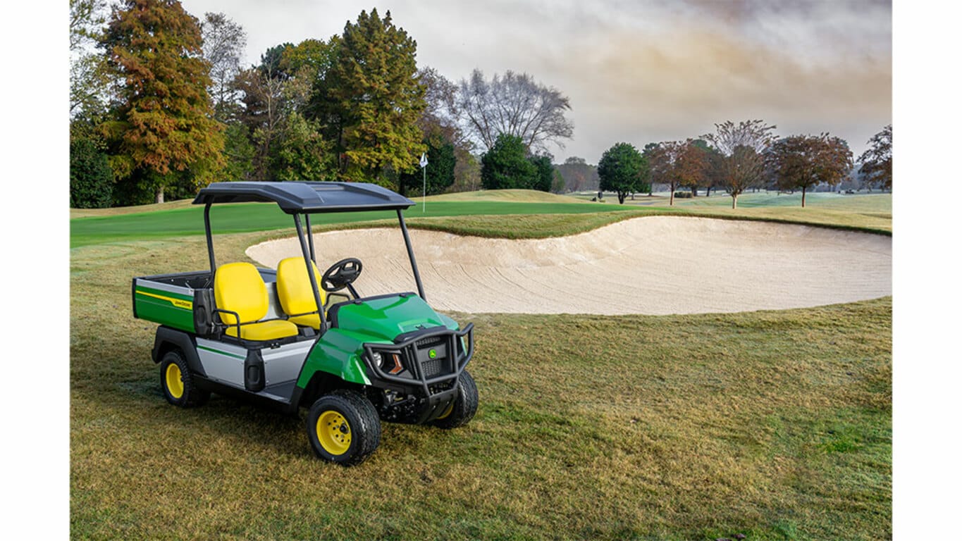 Gator GS electric utility vehicle parked beside a sand bunker on a golf course.