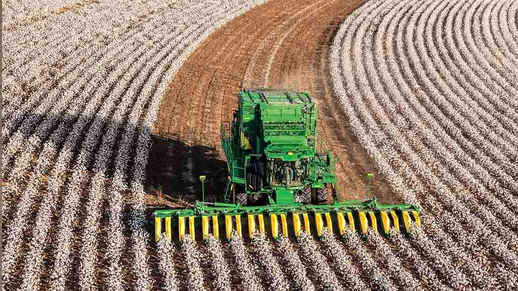A harvester making a semi-circle though a field
