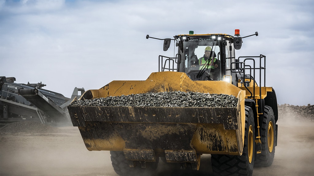 904 P-tier John Deere Large Wheel Loader moving dirt at a work site