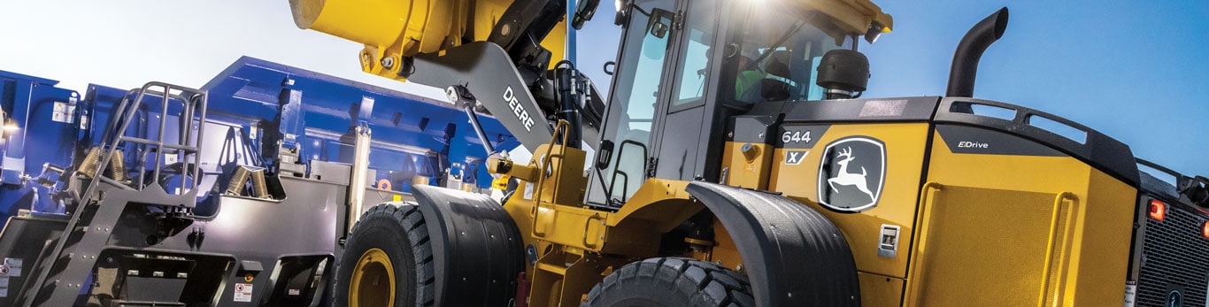 A 644 X-Tier mid-size wheel loader hauls rock to a Kleeman crusher