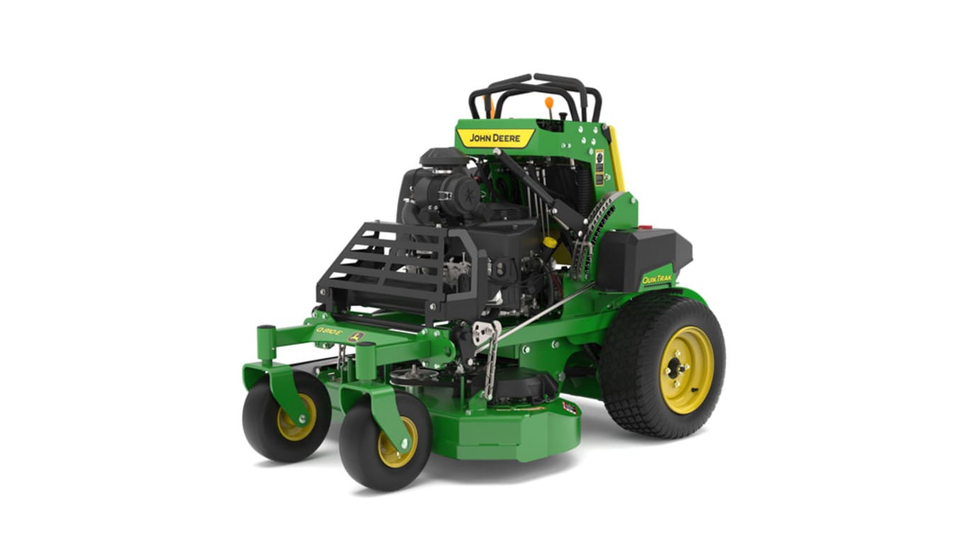 A Q810E front-left-facing studio shot of a green and yellow standing mower on a white background.