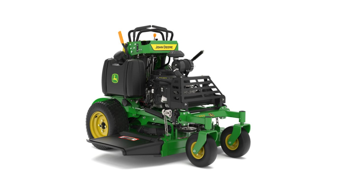 A front-right-facing studio shot of a green and yellow standing mower on a white background.
