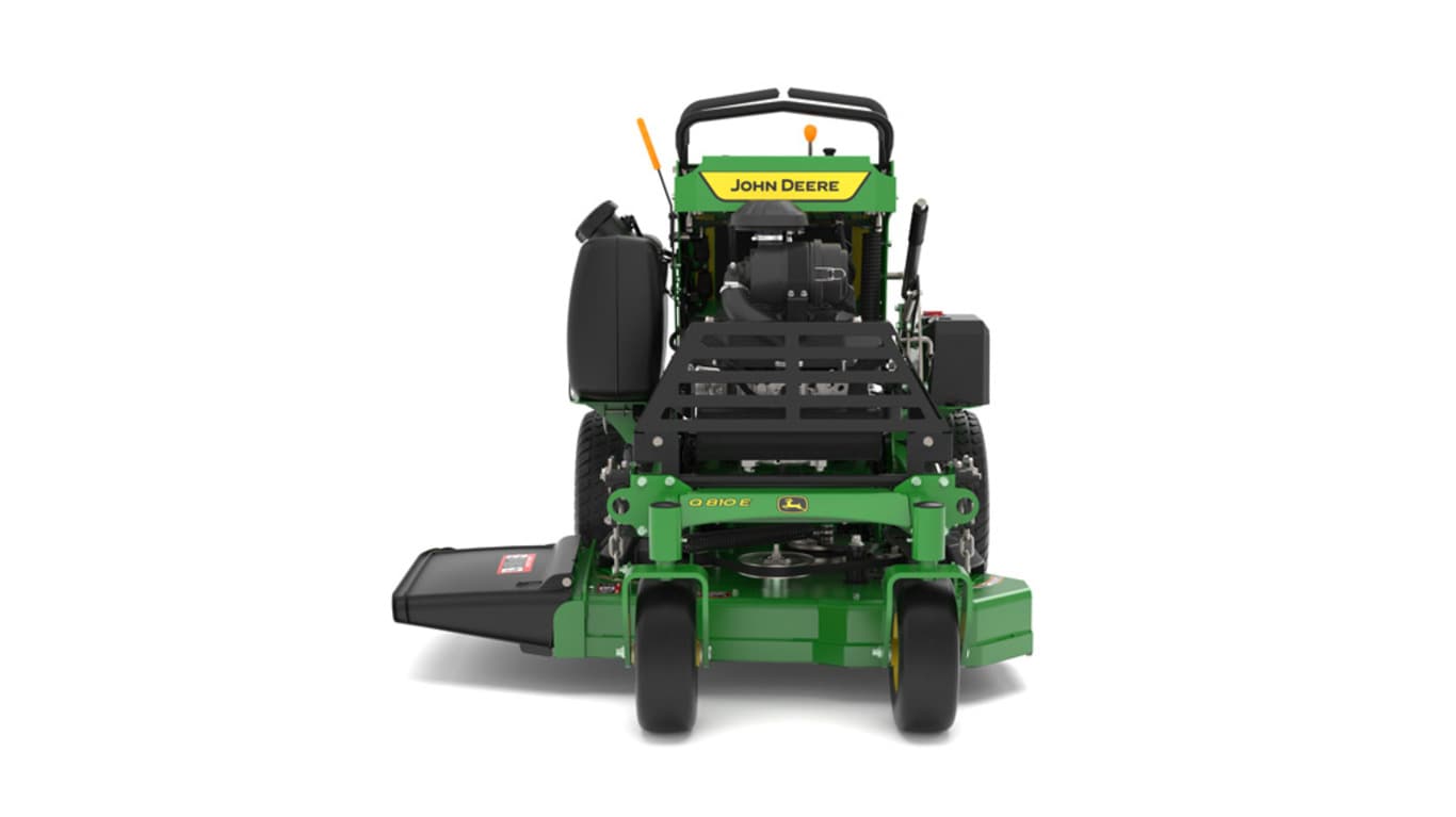A front-facing studio shot of a green and yellow standing mower on a white background.