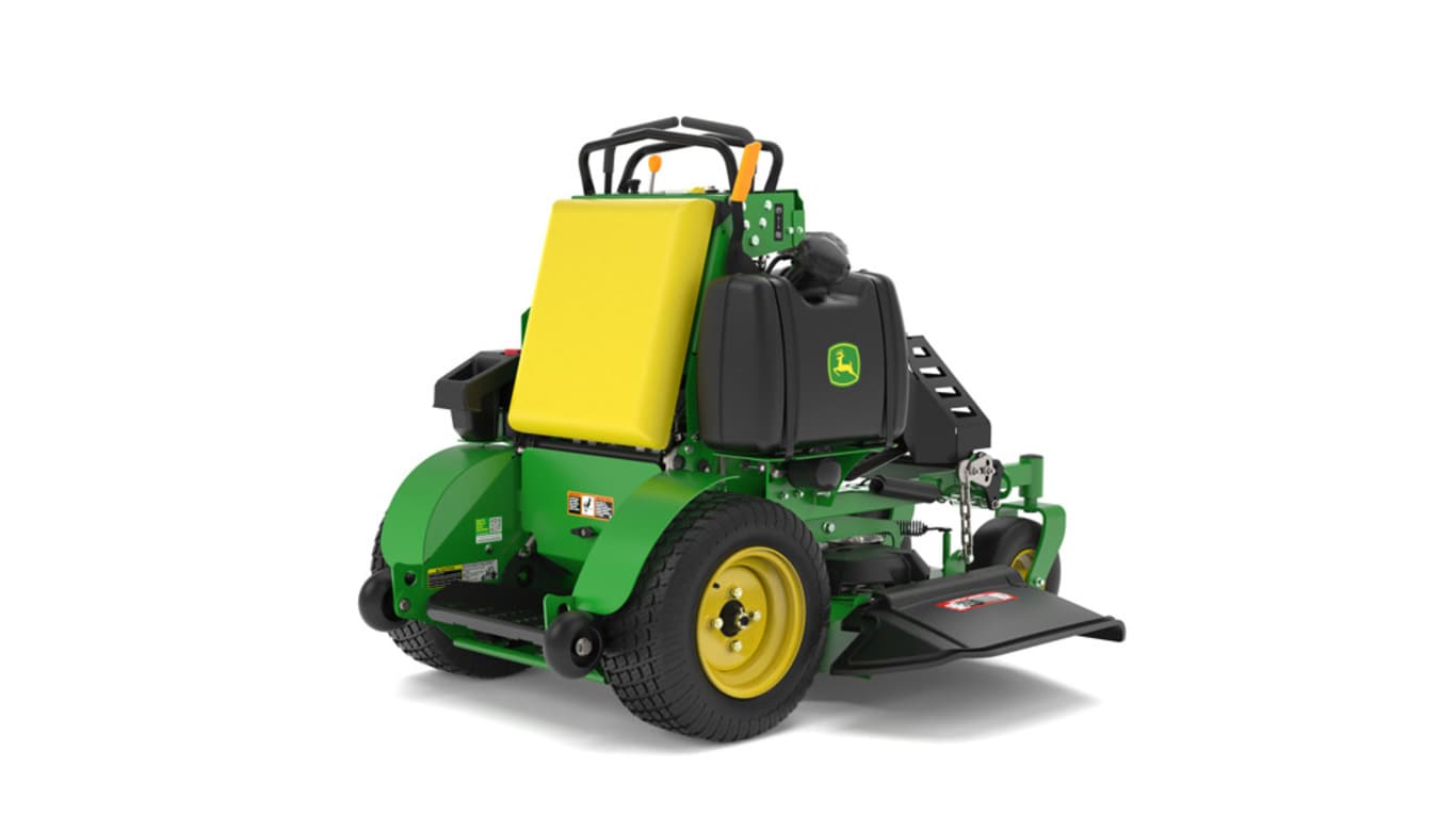 A rear-right-facing studio shot of a green and yellow standing mower on a white background.