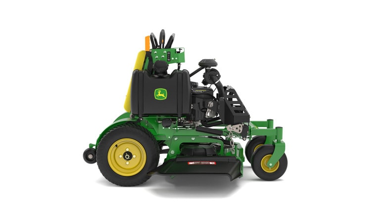 A right-facing studio shot of a green and yellow standing mower on a white background.