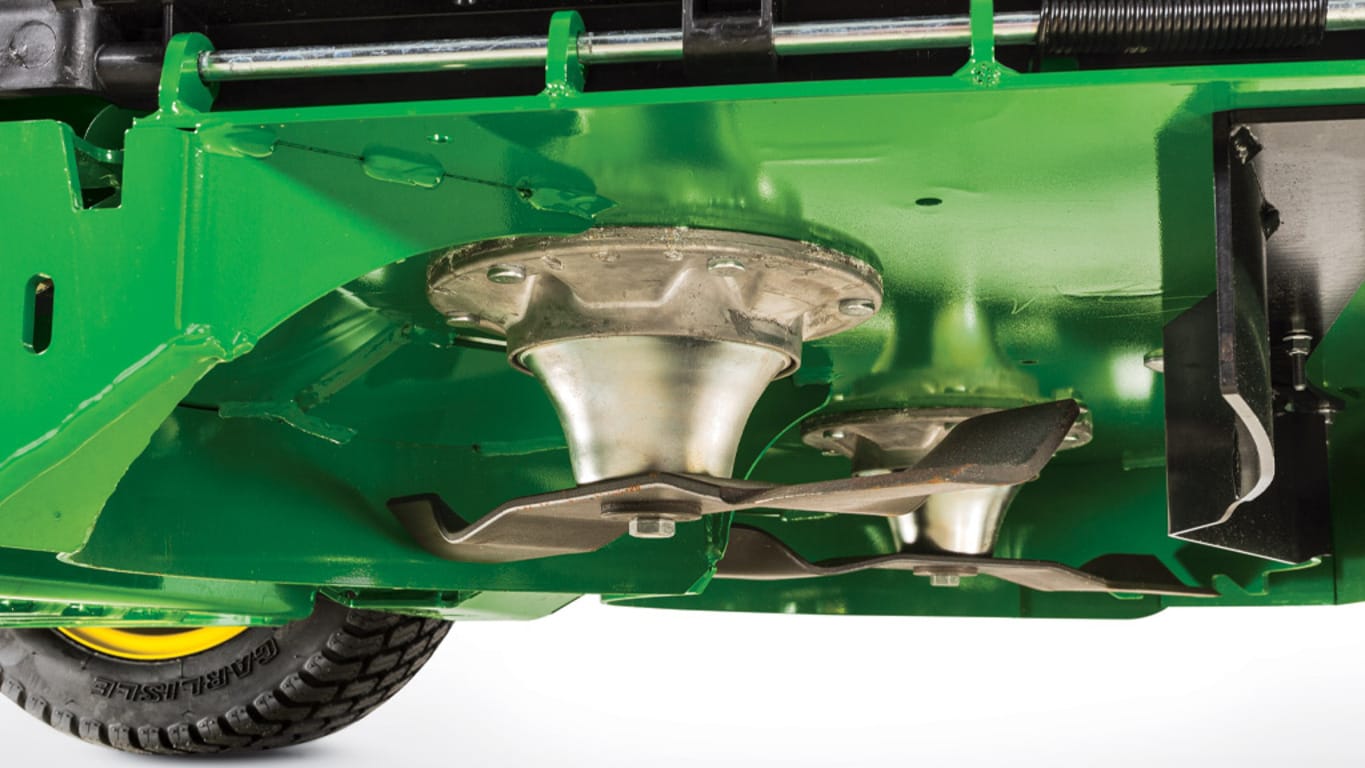 Close up mower deck blades on a Q810E QuikTrak Stand-on mower