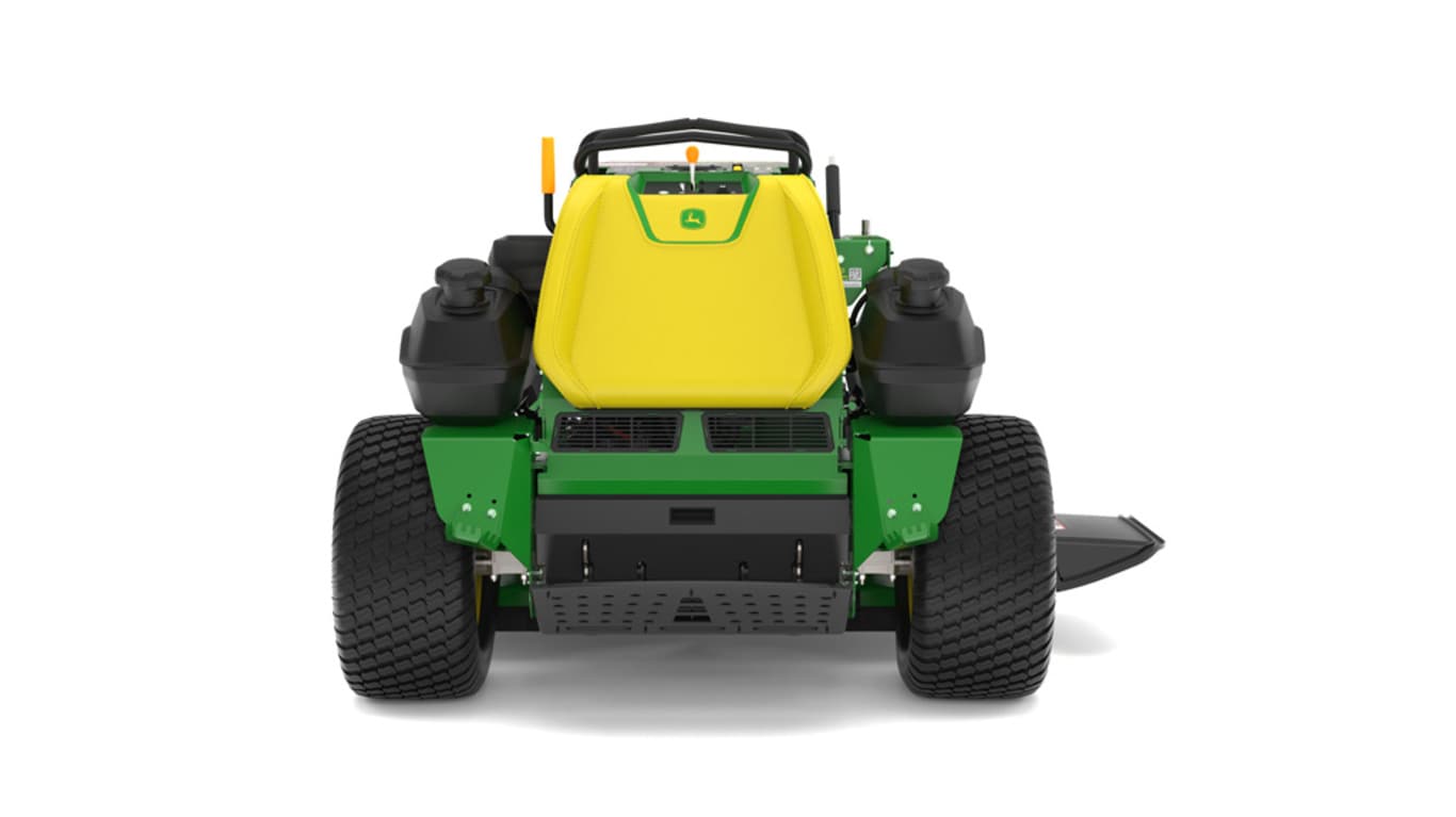 A rear-facing studio shot of a green and yellow standing mower on a white background.