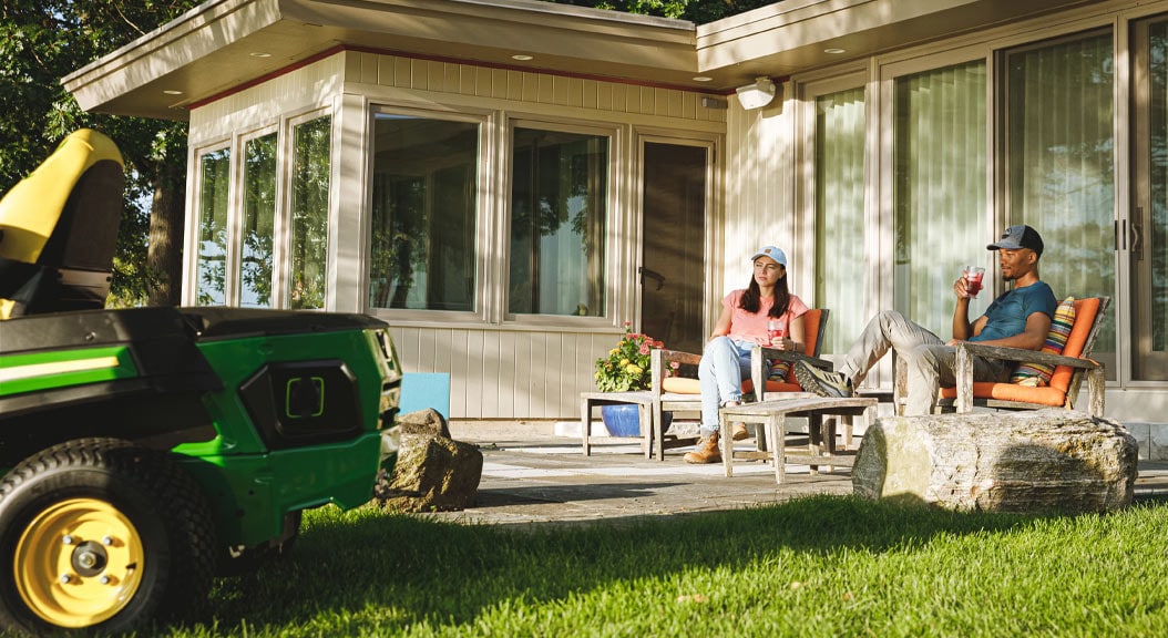 Couple sitting on patio with Z370R in yard