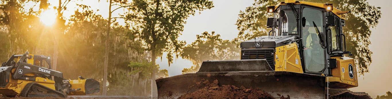 John deere construction vehicle leveling the dirt