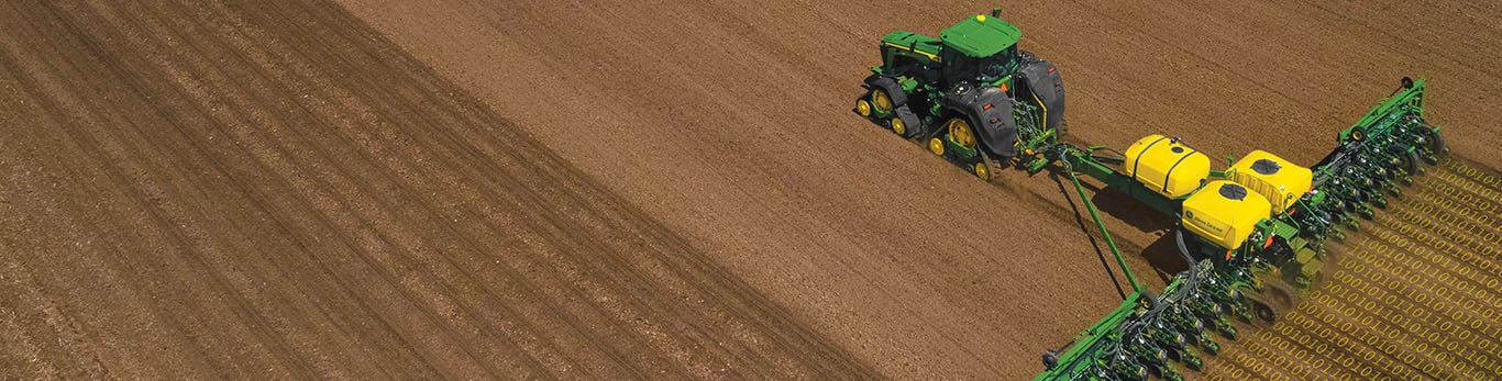 Tractor with planter in field.