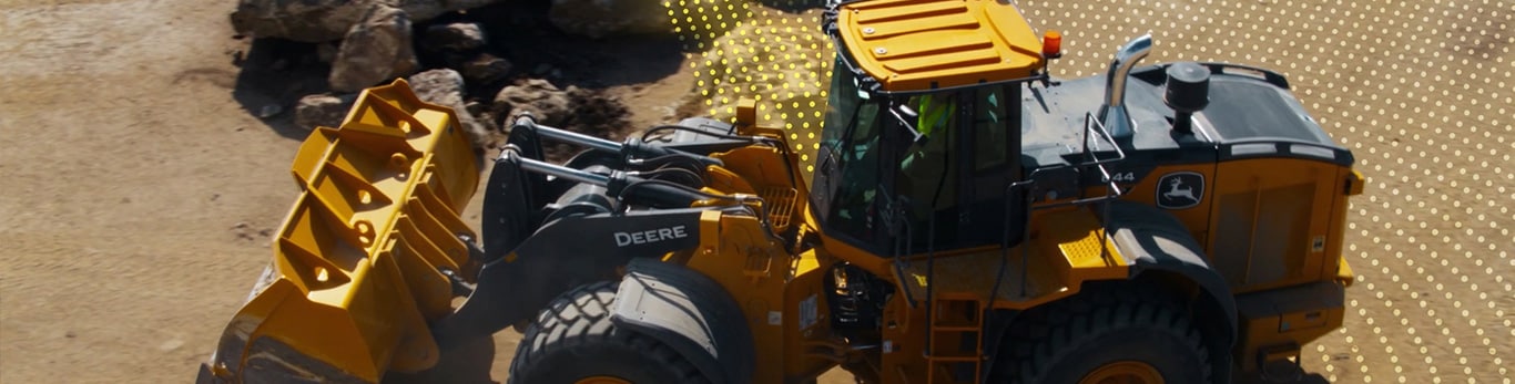 A John Deere 644 P-Tier Wheel Loader with a dotted array sheeting the surrounding, showing obstacle detection.