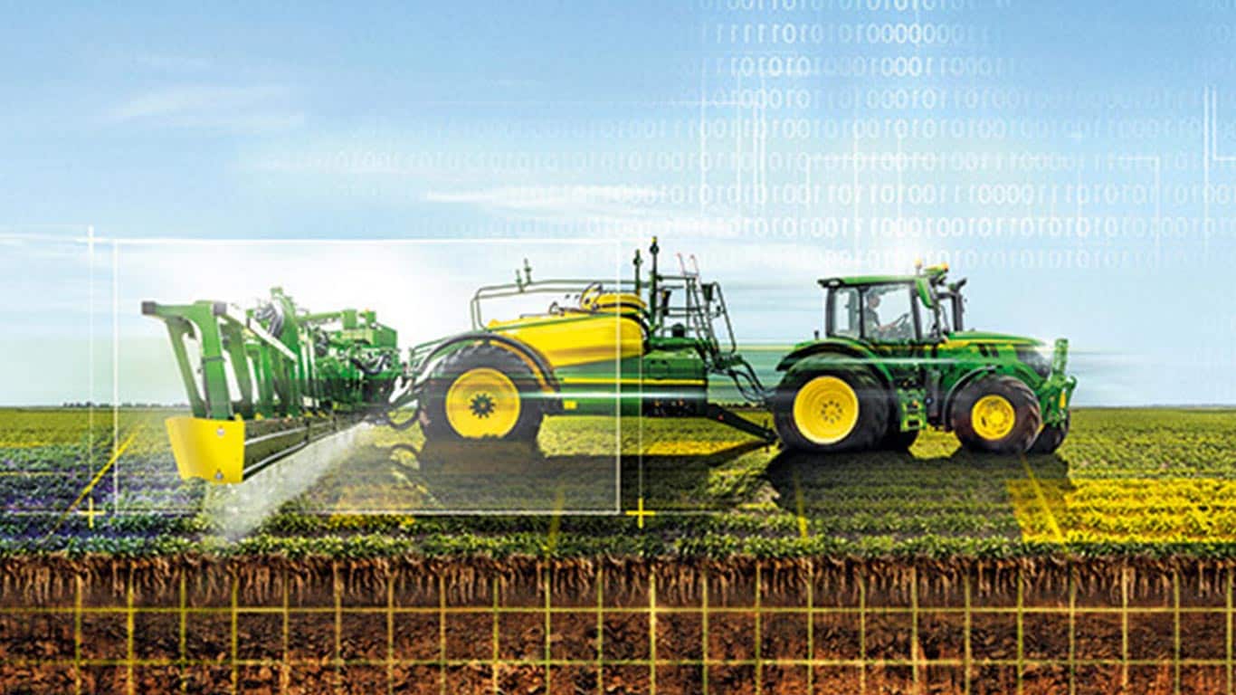 Green and yellow tractor spraying crops in a field with digital overlay elements