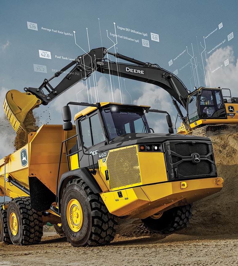 Deere excavator scooping dirt into a Deere dump truck