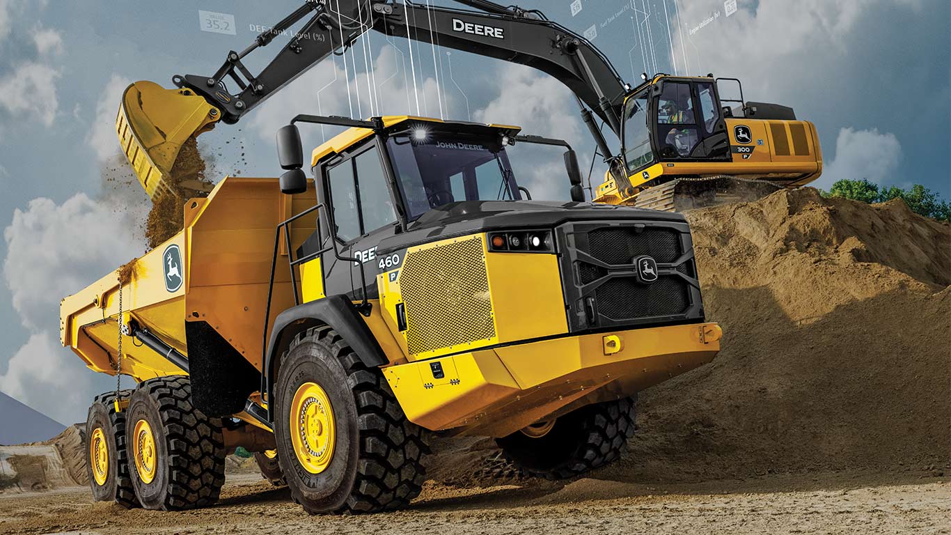 Two yellow construction vehicles, a dump truck and an excavator, working on a dirt mound.