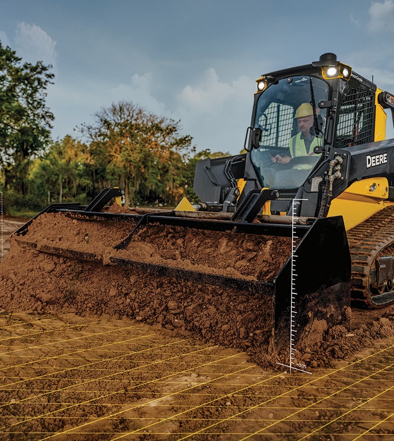 Deere construction equipment pushing dirt