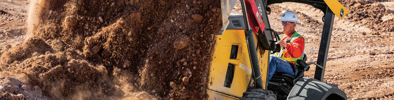 tractor loader moving dirt at construction site