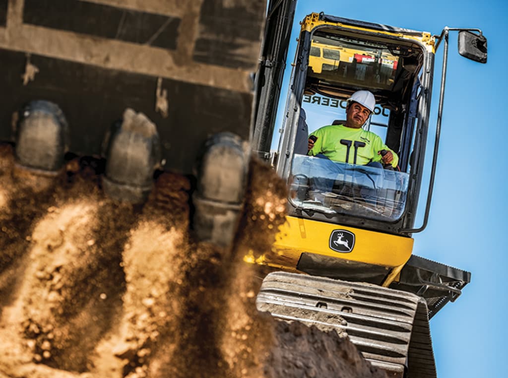 Leonard operates the excavator in the cab of a 470G LC Excavator.