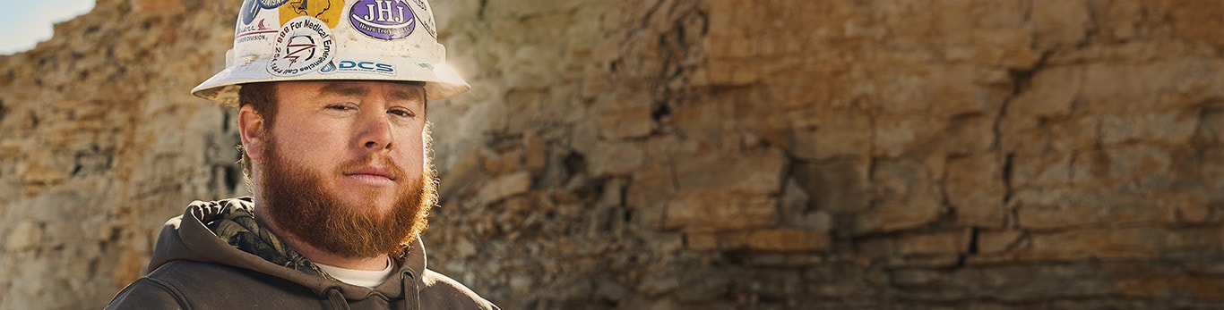 Dylan Youngblood, an operator with Zack Burkett Co., stands in a limestone open pit at Leach Pit Quarry in Texas.