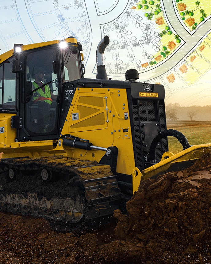 A John&nbsp;Deere 700L XLT SmartGrade Dozer carves out swales and slopes while grading roads and building pads for the housing development site.