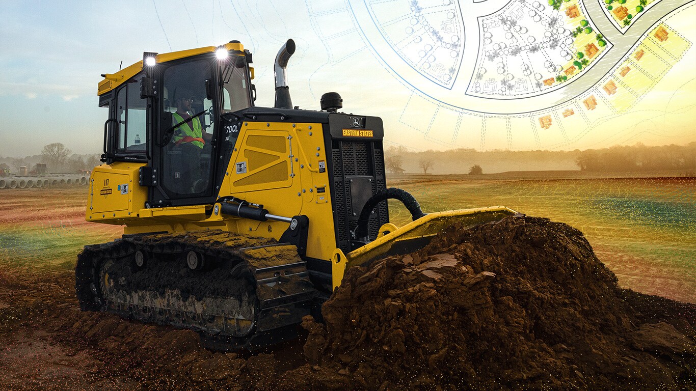 TA John Deere 700L XLT SmartGrade Dozer carves out swales and slopes while grading roads and building pads for the housing-development site.