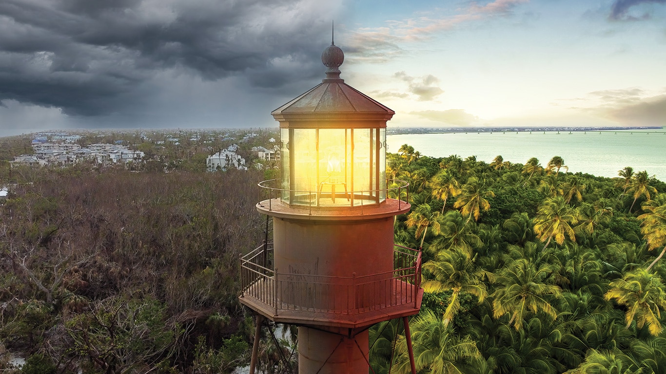 To the left of the Sanibel Island Lighthouse in the middle, the aftermath on the island is pictured. On the right, the island is seen before the hurricane hit.