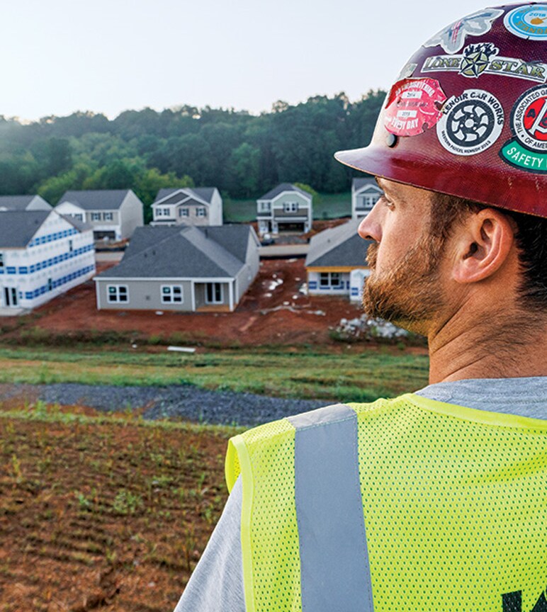 Thomas Karczmarczyk of KZ Construction looks across a housing development jobsite.