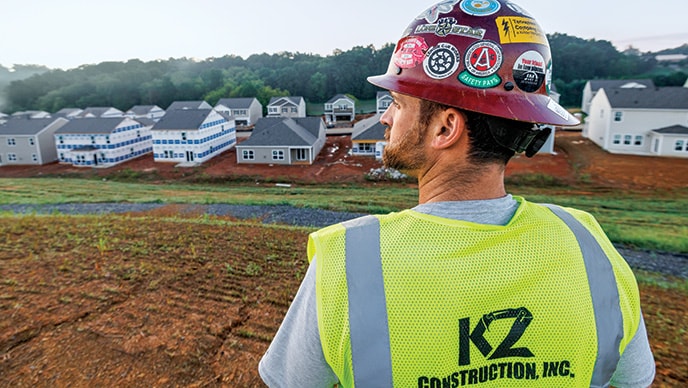 Thomas Karczmarczyk of KZ Construction looks across a housing development jobsite.