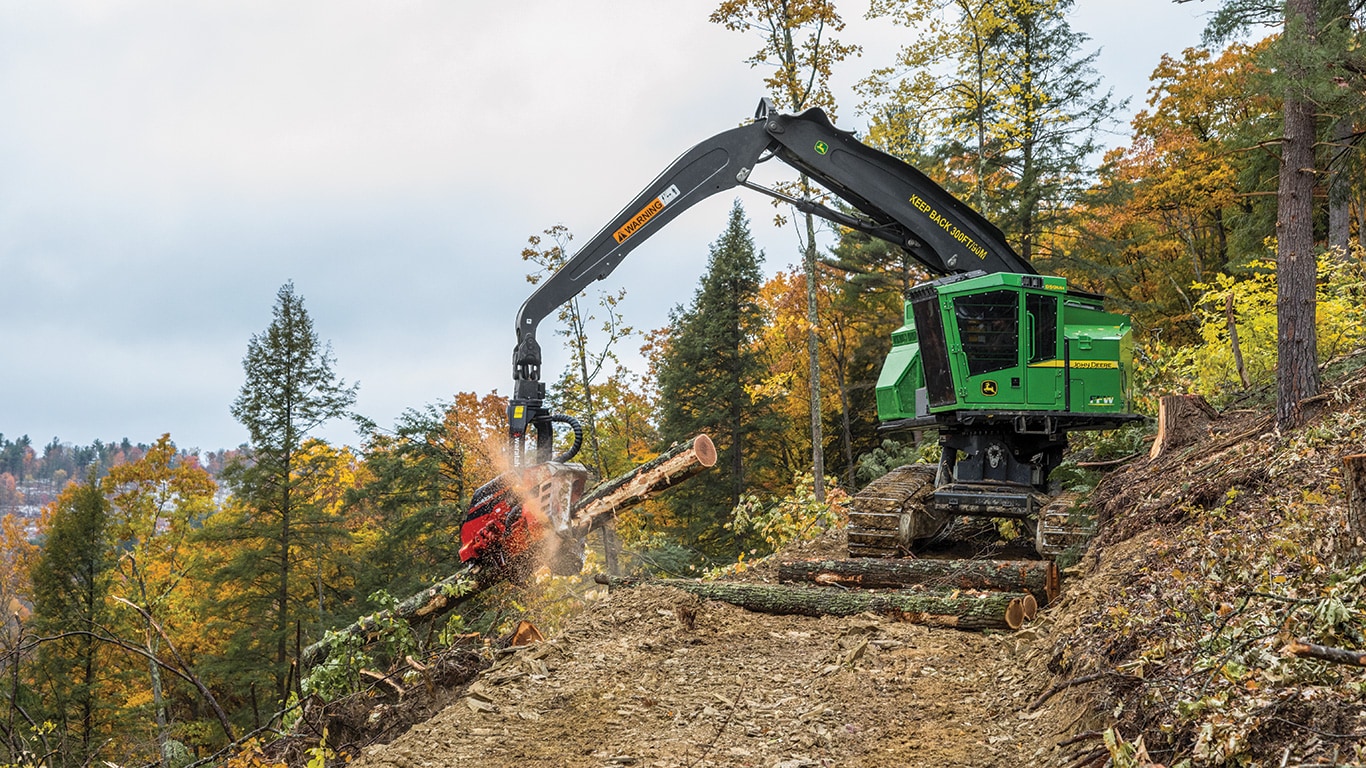 Rocky Ridge Trading Company uses a John Deere 859MH Tracked Harvester with a Waratah HTH623C Harvester Head to process hardwood logs in a steep-sloped Pennsylvania forest.