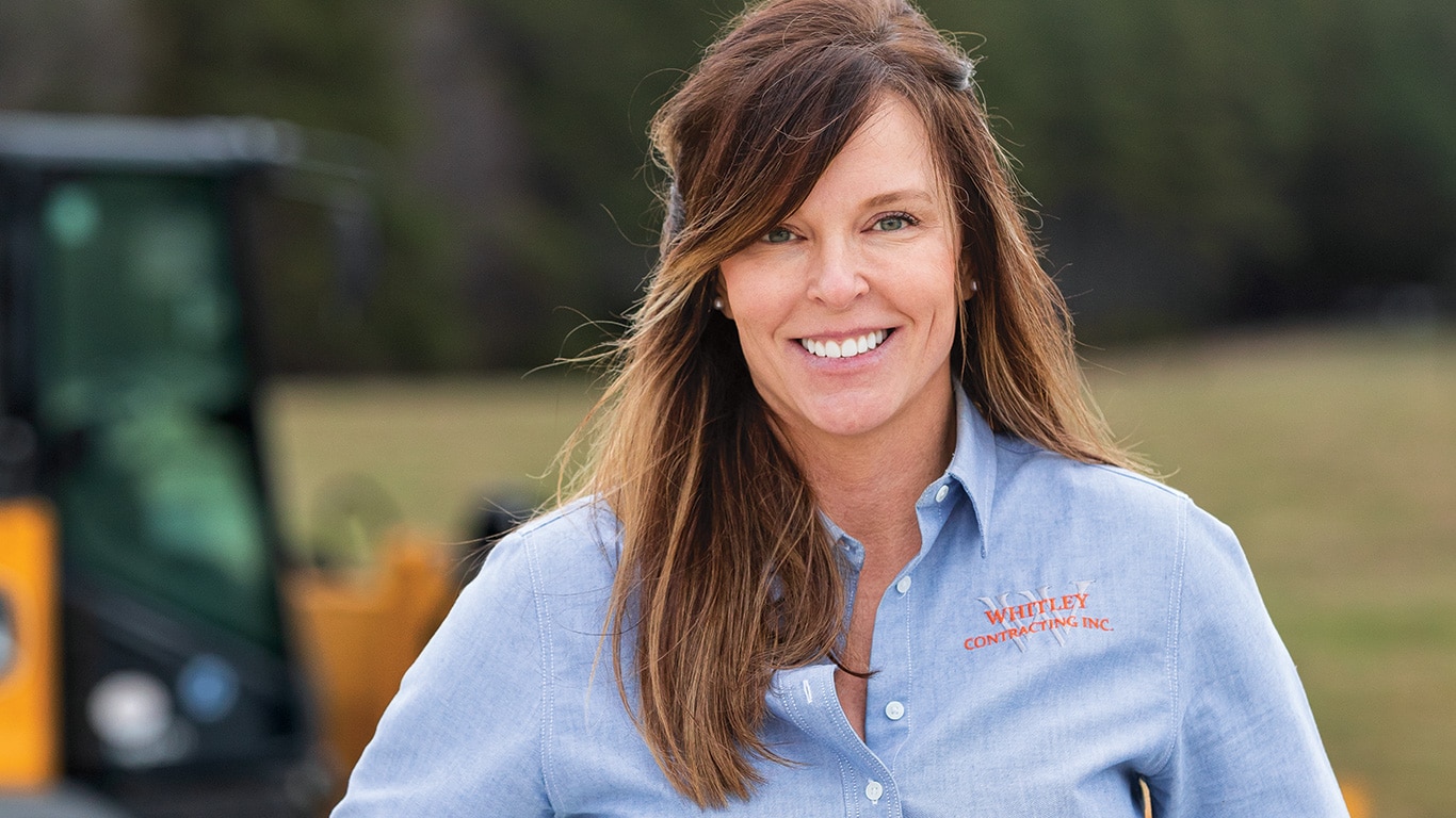 Brandy Whiley standing at a jobsite looking toward the camera.