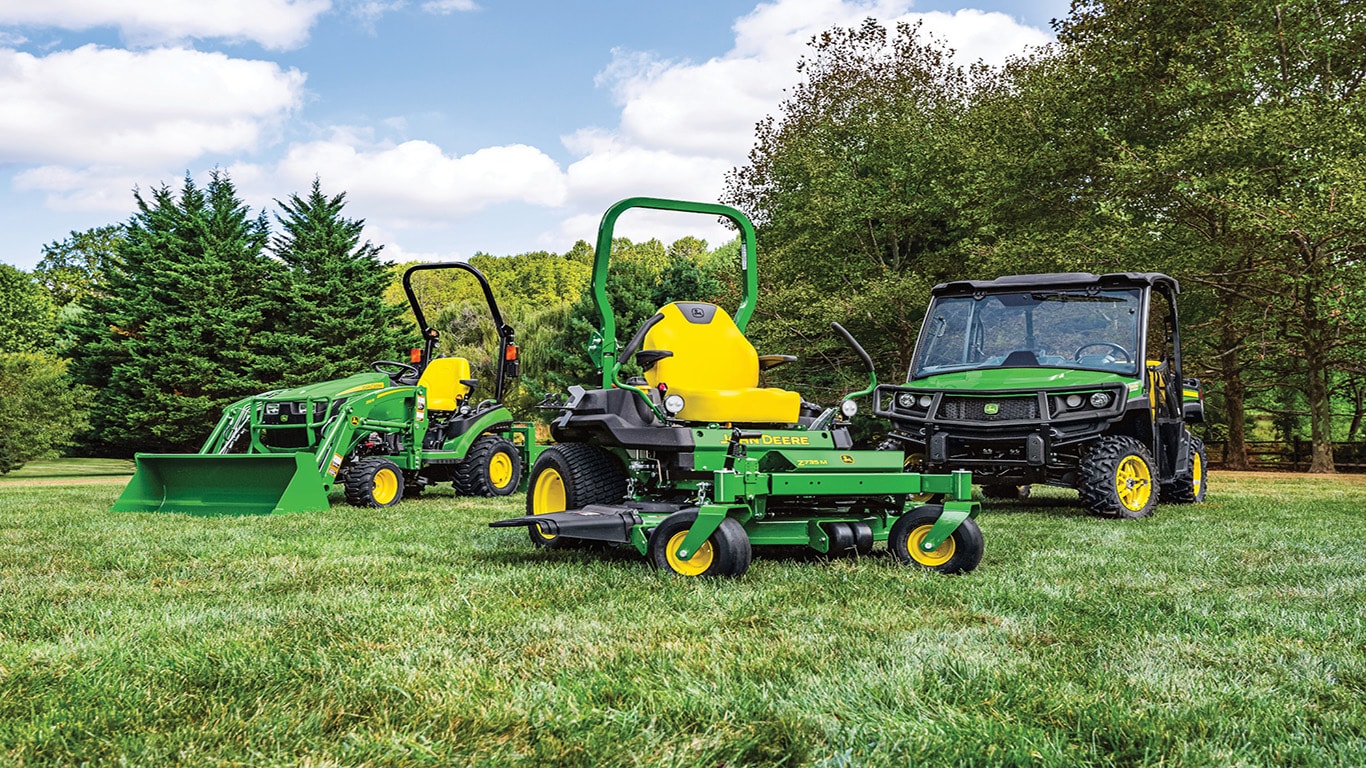 image of John Deere equipment in field under sunset