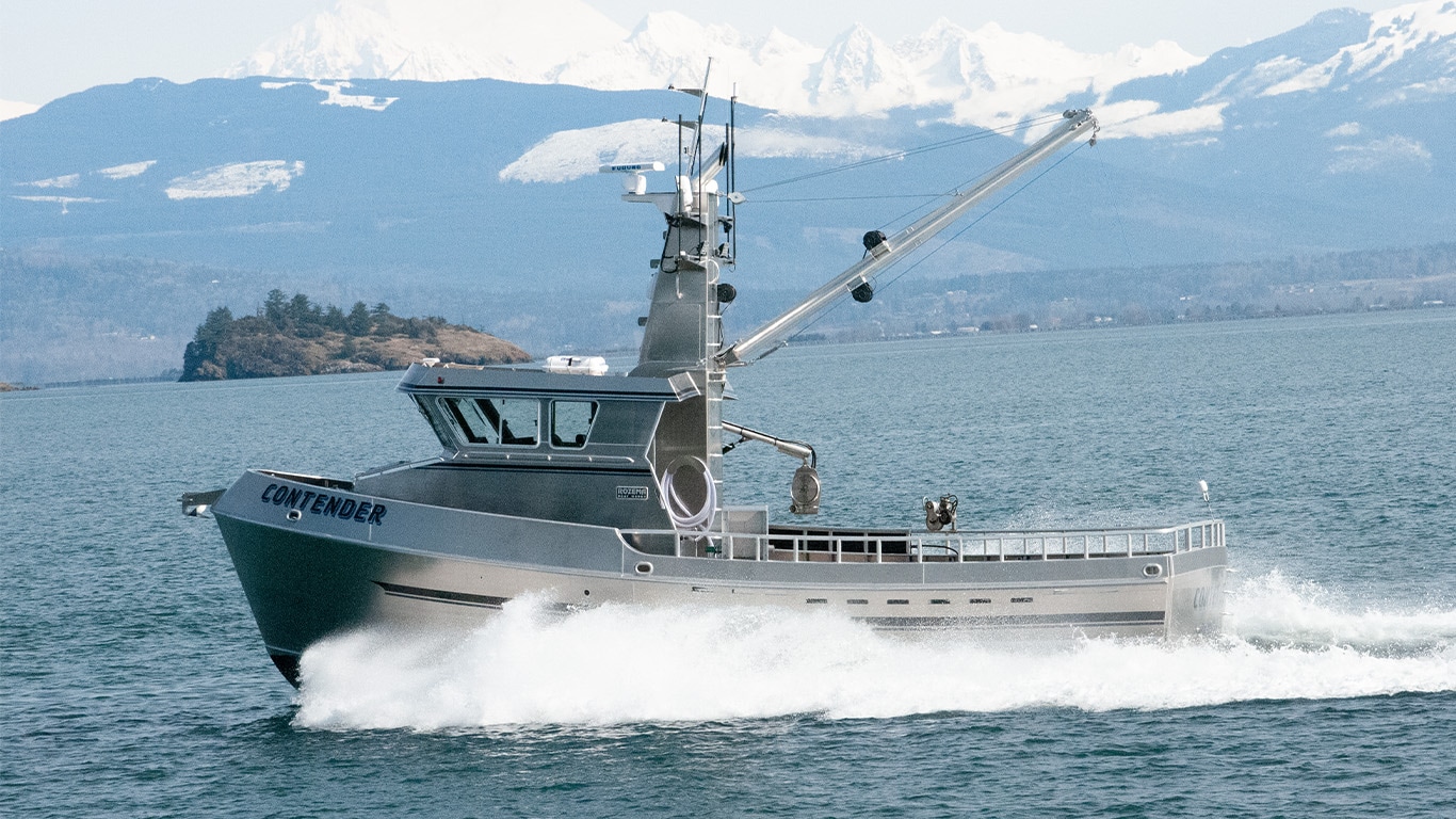 The Contender fishing boat cruising out on the waters of the Pacific Northwest powered by a John Deere marine engine.