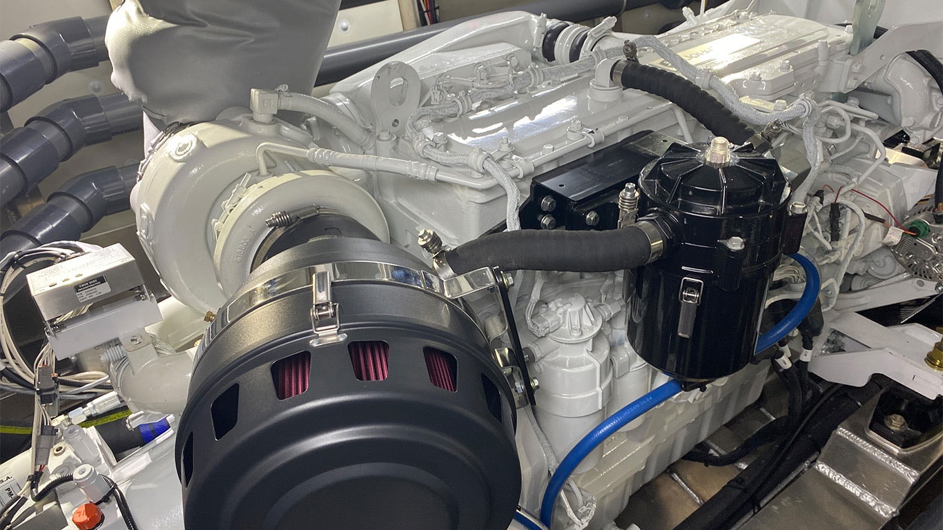 A John Deere marine propulsion engine inside of The Contender fishing boat.