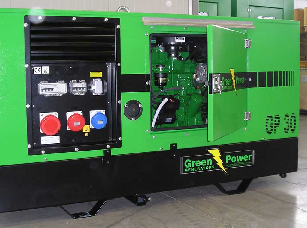 A Green Power genset powered by a John Deere industrial engine sitting inside a building