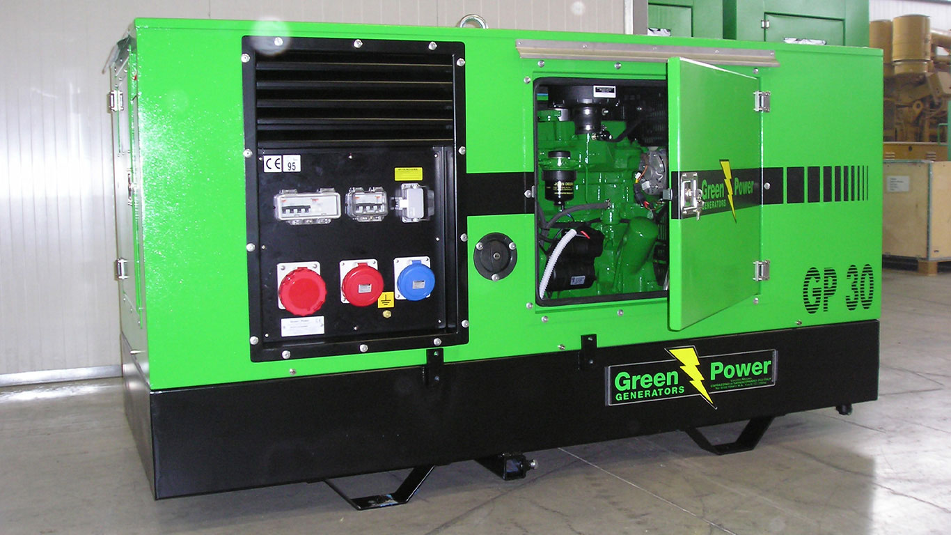 A Green Power genset powered by a John Deere industrial engine sitting inside a building