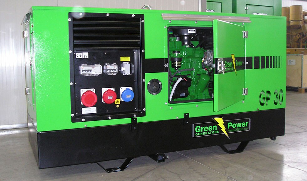 A Green Power genset powered by a John Deere industrial engine sitting inside a building
