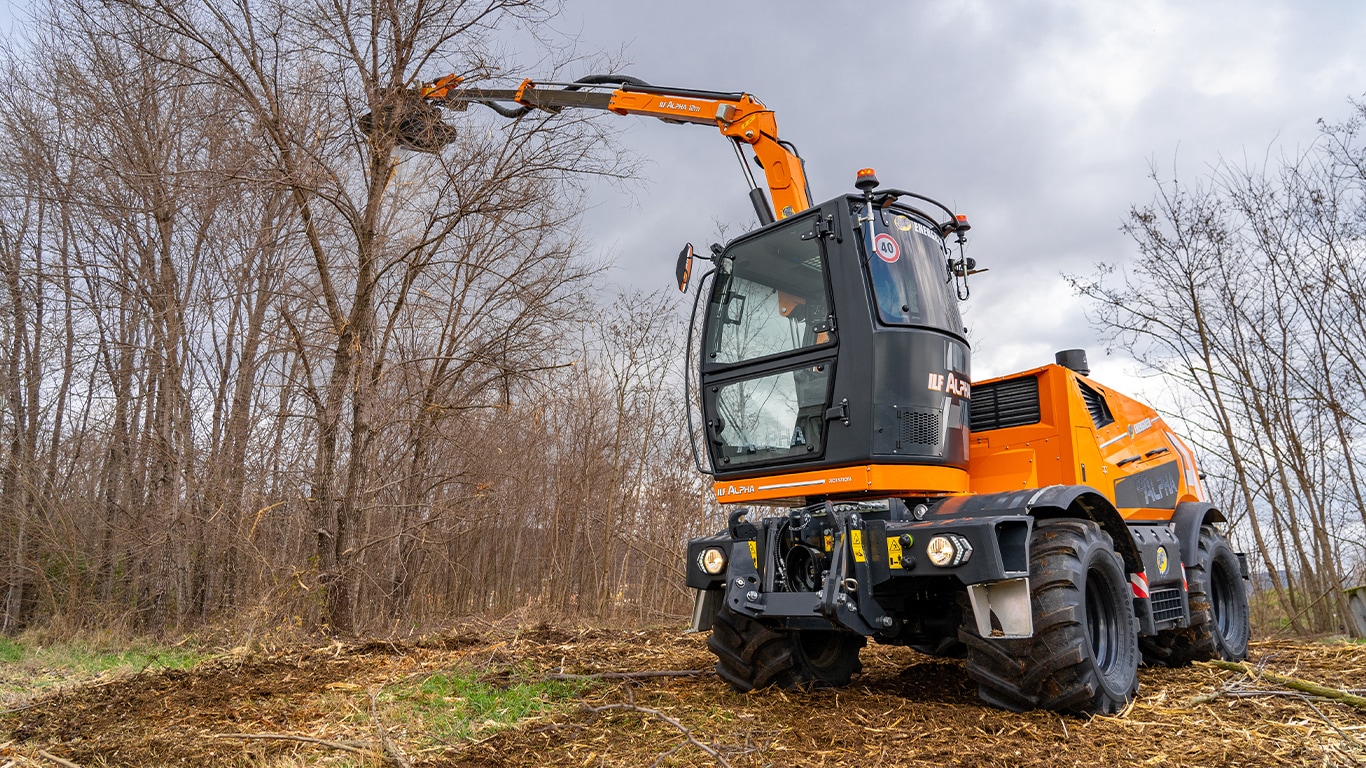 Energreen’s hydrostatic tool carrier powered by a John Deere industrial engine cutting down trees