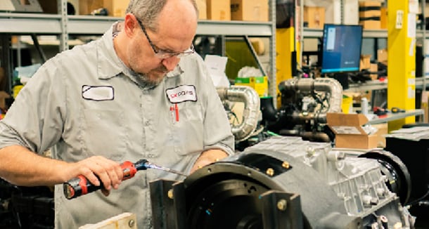 Technician working on an industrial diesel engine. 