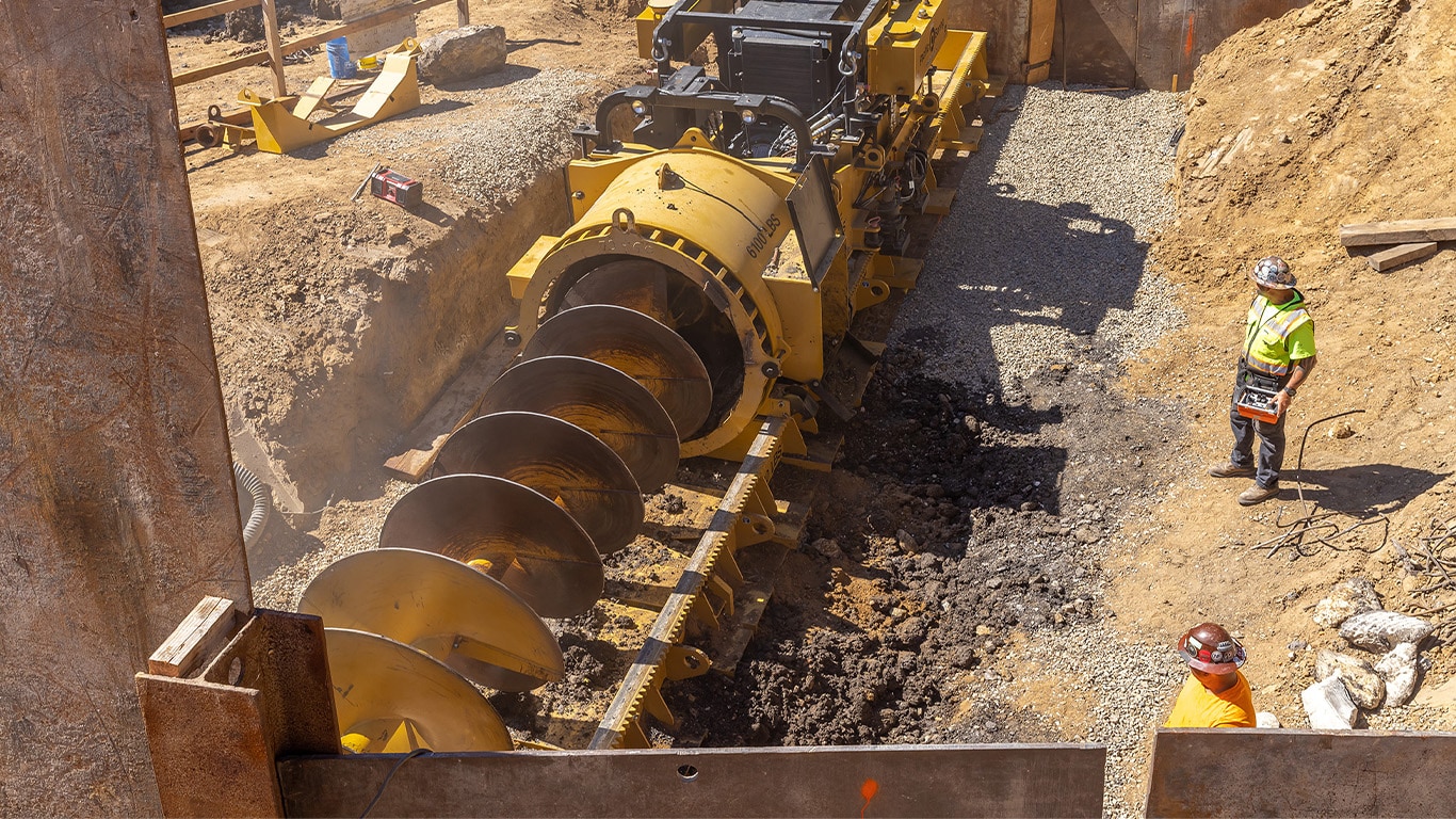 An MBM auger boring machine at work in a trenchless construction jobsite