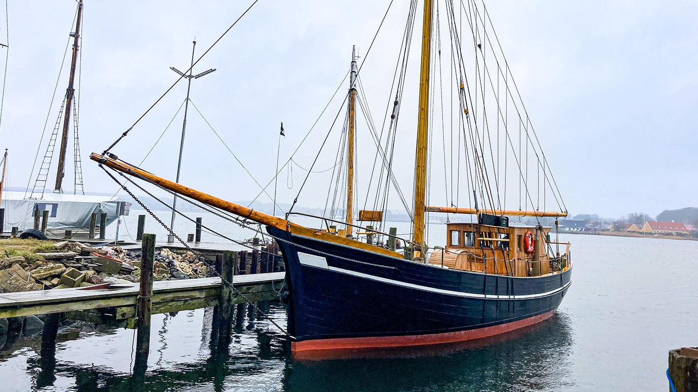 Petersen Tegl’s wooden sailing ship docked in the harbo