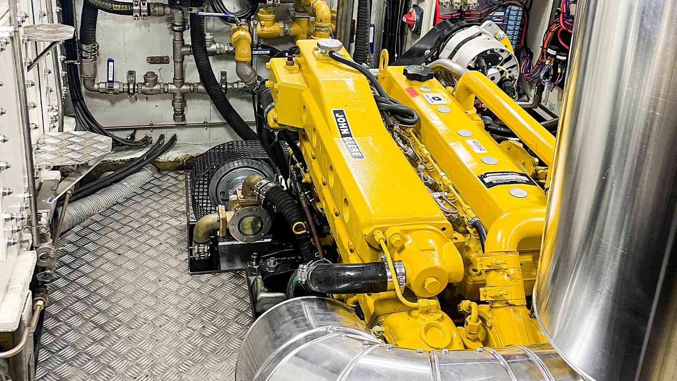 A John Deere 6.8L marine engine inside of Emma, Petersen Tegl's wooden sailing ship