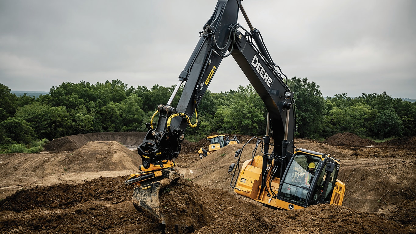 John Deere 245G LC Excavator digging on a track