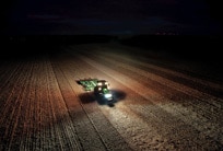 AMS: John Deere tractors in field
