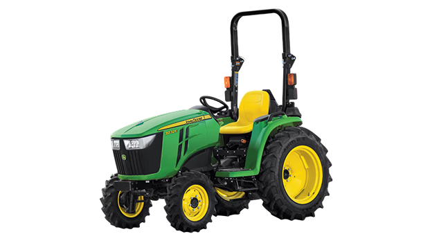A front-left-facing studio shot of a green compact tractor on a white background.