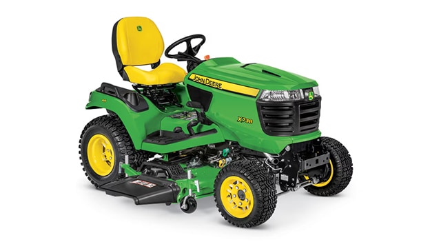 A front-right-facing studio shot of a green riding lawn mower on a white background.