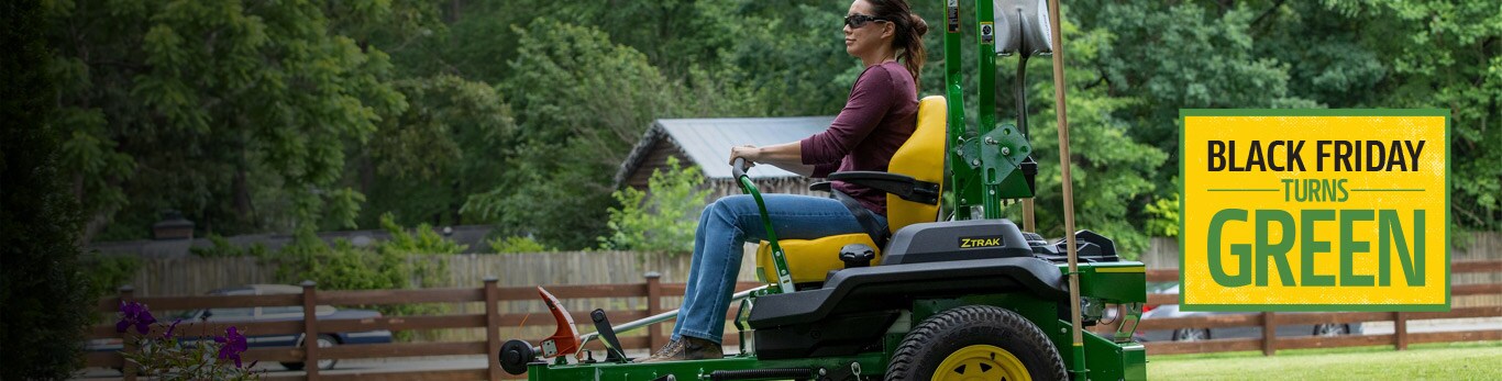 Person operating a zero-turn mower 