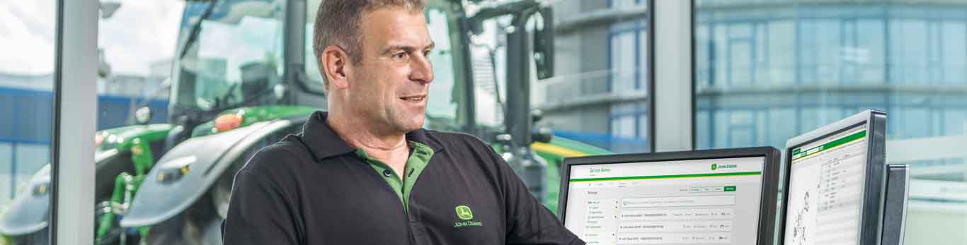 Lication Financing John Deere Us Image Of Man Looking At Desktop Computer